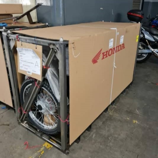 Honda bike in a crate